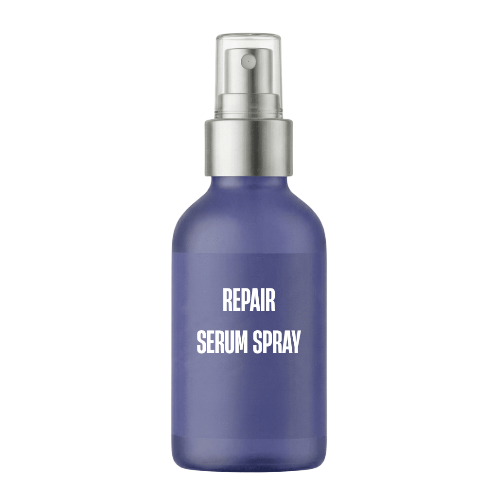 Premium Repair Serum Spray in a blue glass bottle with mist spray applicator for skincare.