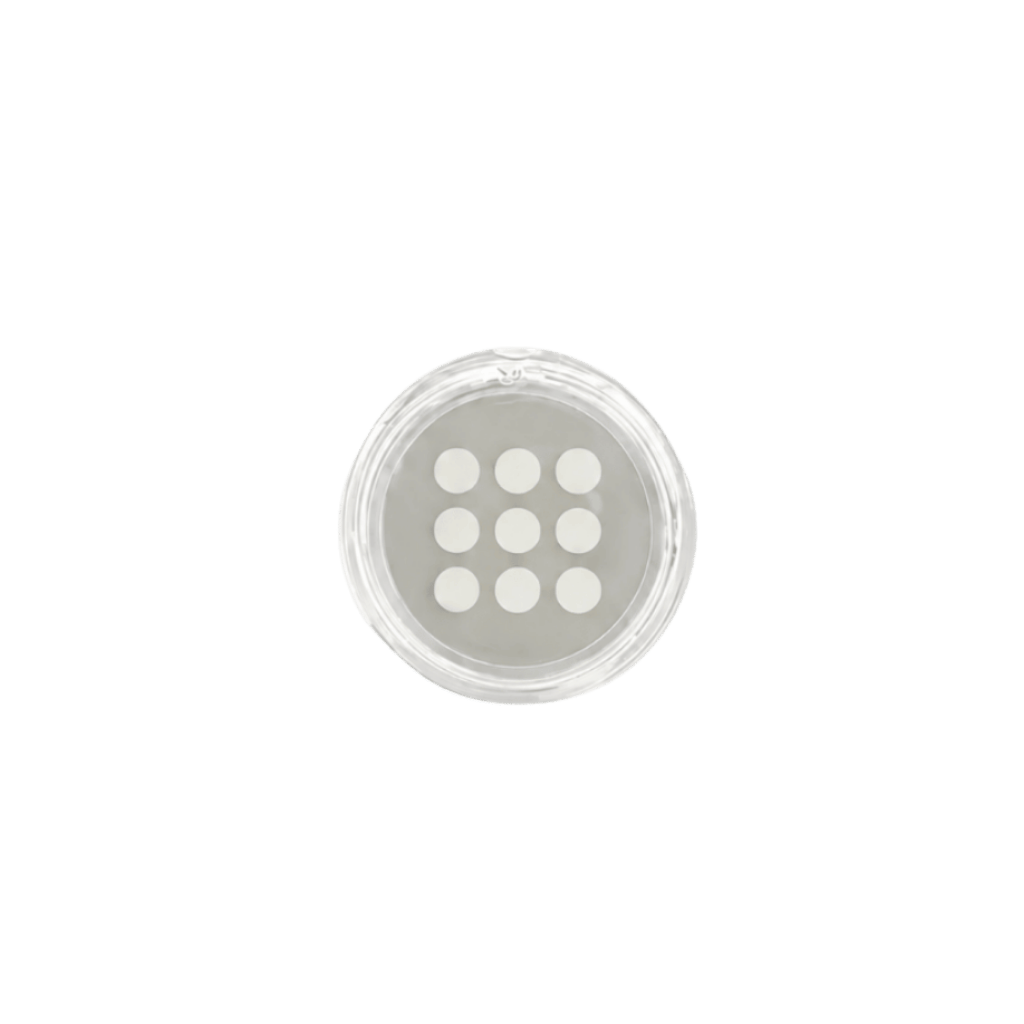 Premium Nourishing Patches in a clear container showing nine circular patches for targeted skin care.