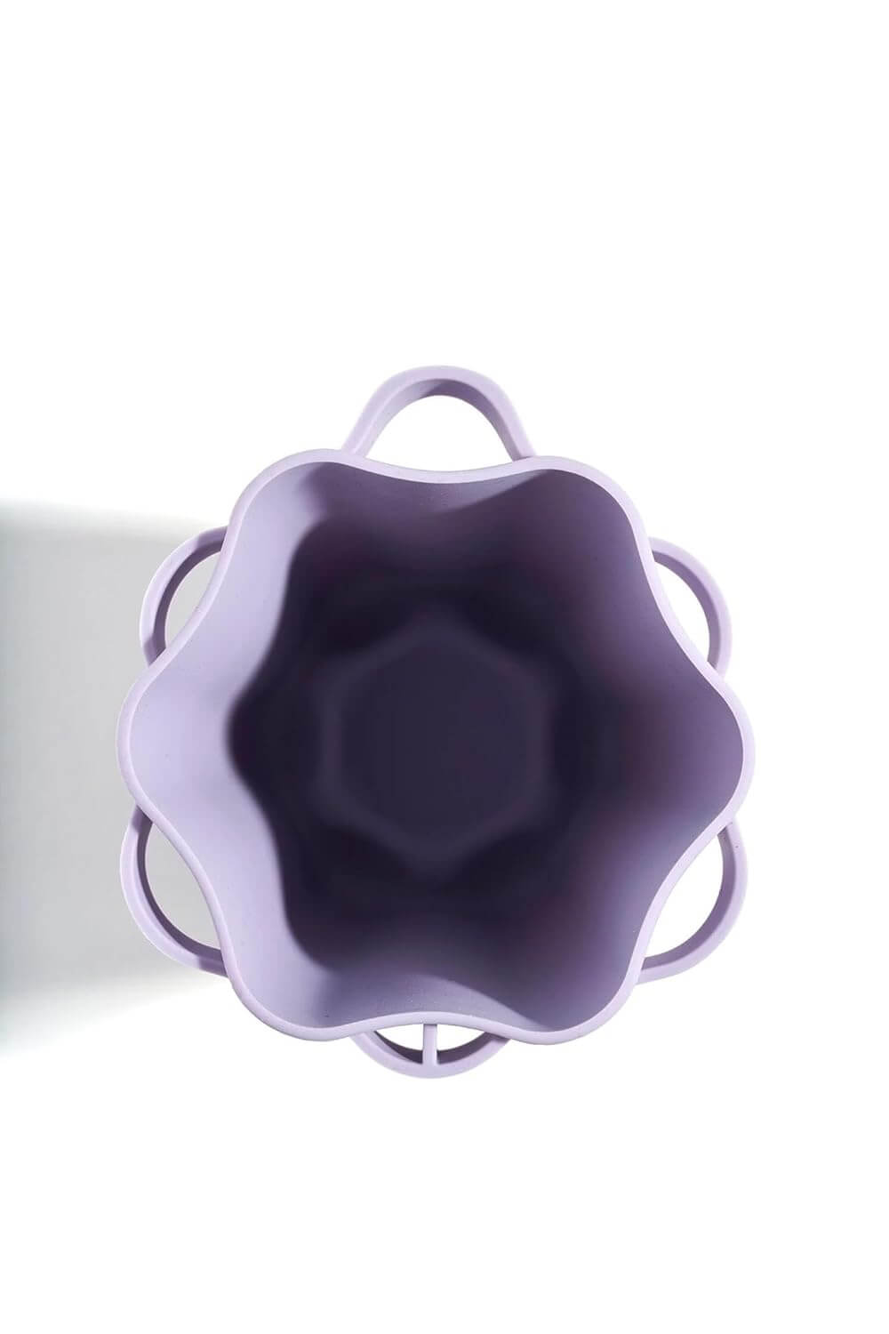 Top view of the Revibe Zen Brush & Holder Set in a soft touch lavender color, showcasing its elegant design.