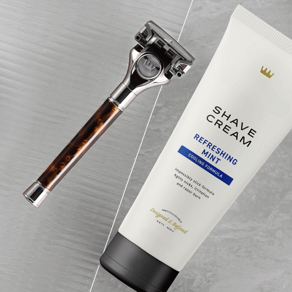 Revibe Zen Cooling Shave Cream and razor on a marble surface, featuring a refreshing mint cooling formula.